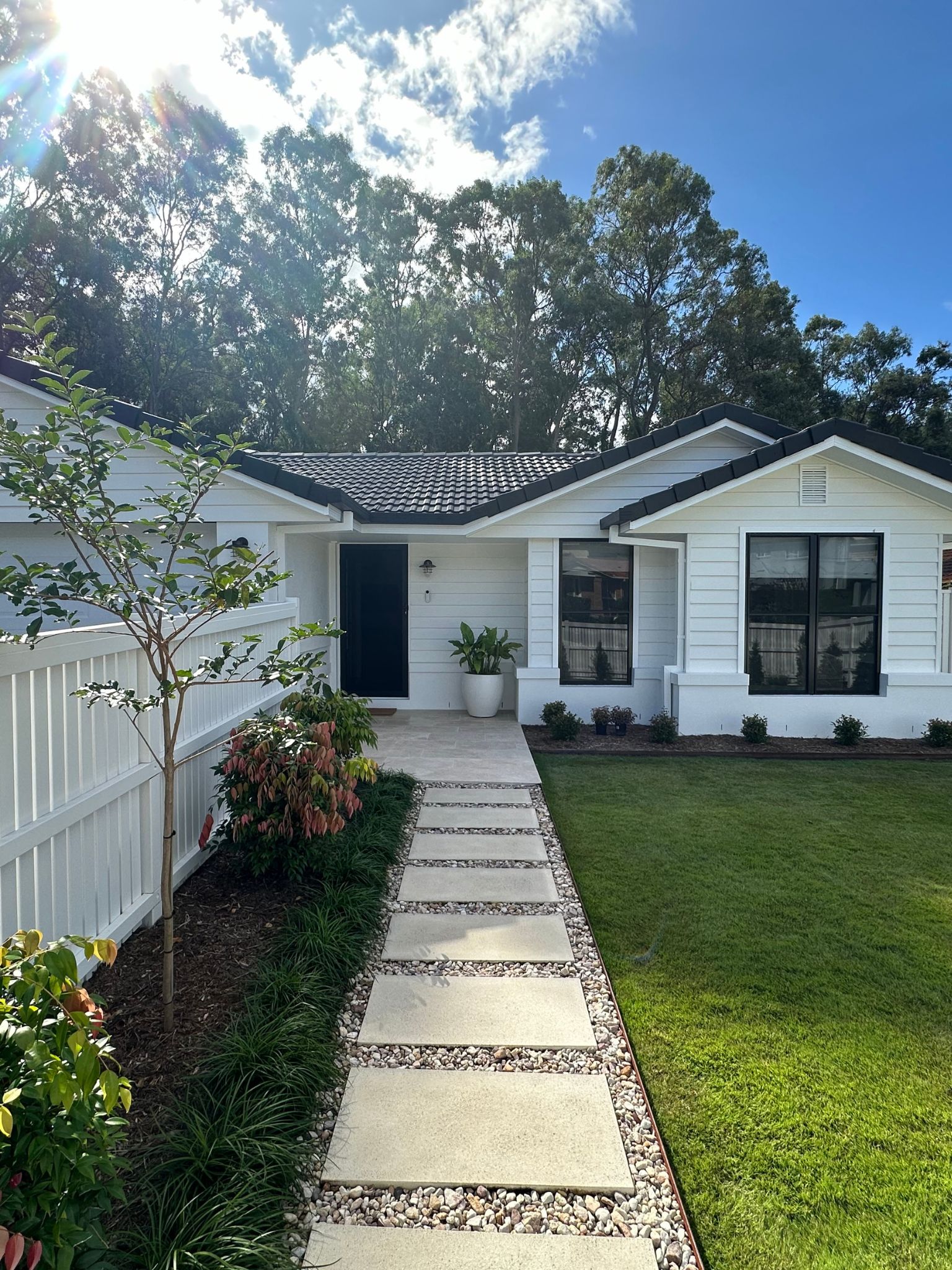 Renovated Brisbane home with modern design and landscaped front yard