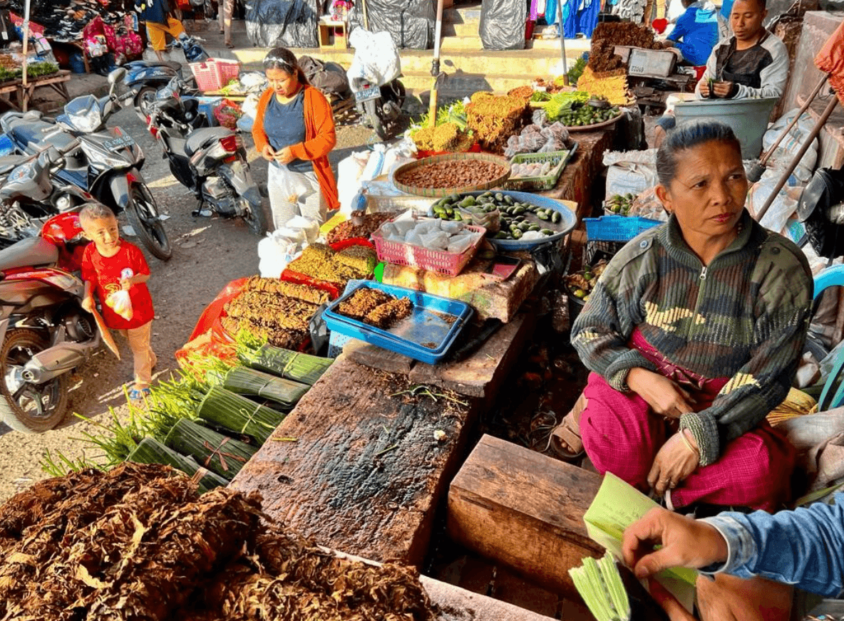 food market with people around it