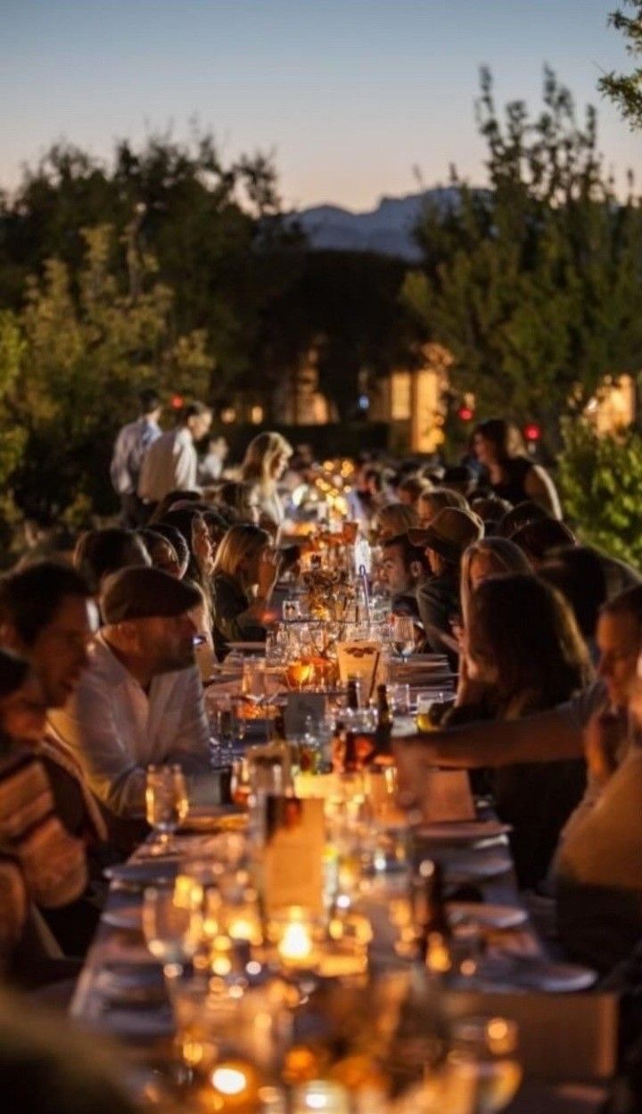 A man playing a drum in front of a group of people