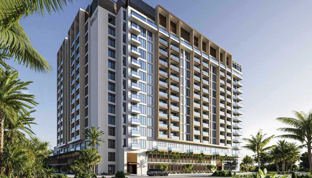 New beachfront hotel in Miami, part of 'The Collection,' showcasing modern architecture and ocean views.