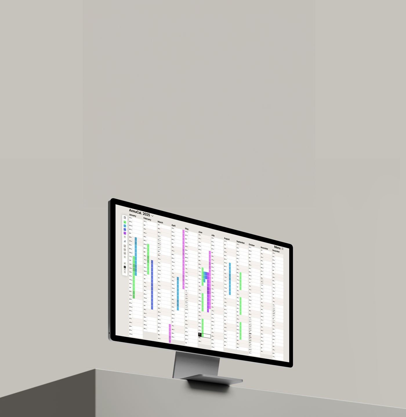 A large screen monitor shows Annucal Yearly Calendar View