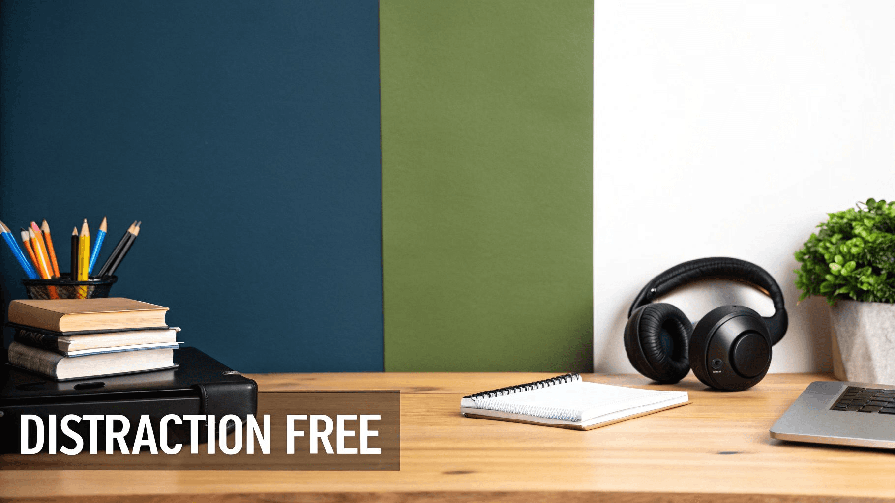 A cleaned up empty workspace with white text on black background saying distraction free. 