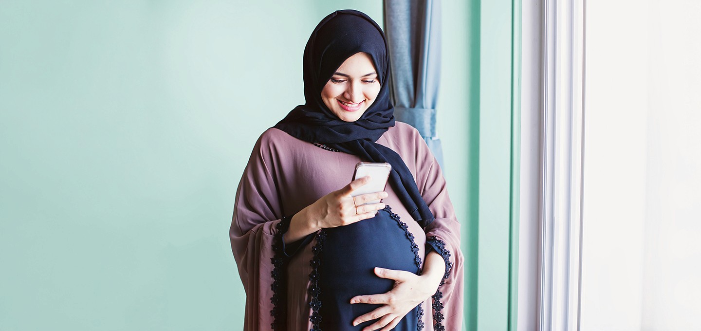 Arabic girl looking at mobile - Arabic Names 
