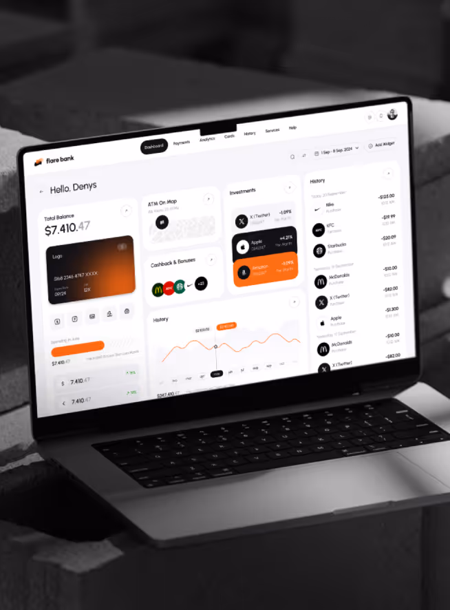 Laptop screen showing Flare Bank dashboard with total balance, card details, cashback offers, investment tracking, and transaction history.