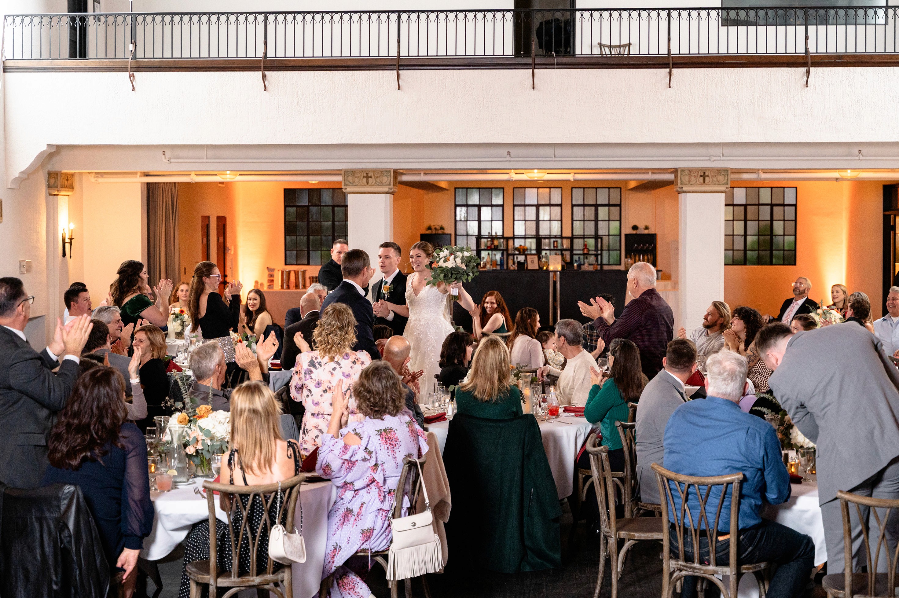 Flat lay wedding details with bouquet, rings, and sparkling bridal heels