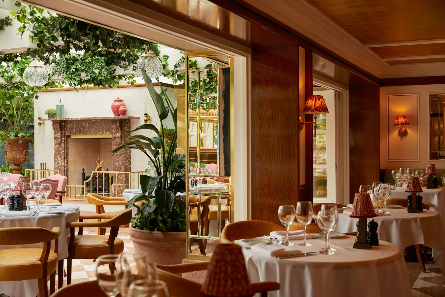 San Carlo restaurant dining room with timber wall panelling, fireplace and bespoke fit-out details