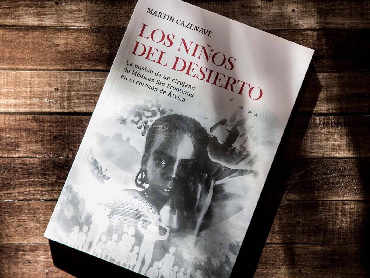 Rustic cabin in a golden field at sunset