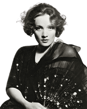 A glamorous black-and-white portrait of Marlene Dietrich, the iconic German-American actress and singer, known for her striking beauty and enigmatic presence. Dressed in a dark, elegant outfit, she holds a decorative fan, enhancing the sense of allure. Her softly curled hair and intense gaze reflect the classic Hollywood style of the early 20th century. Dietrich became a symbol of sophistication and rebellion, known for her roles in films like "The Blue Angel" and her groundbreaking androgynous style, which challenged gender norms and cemented her as a cultural icon.