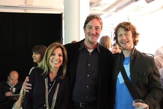 a group photo of two men and a woman