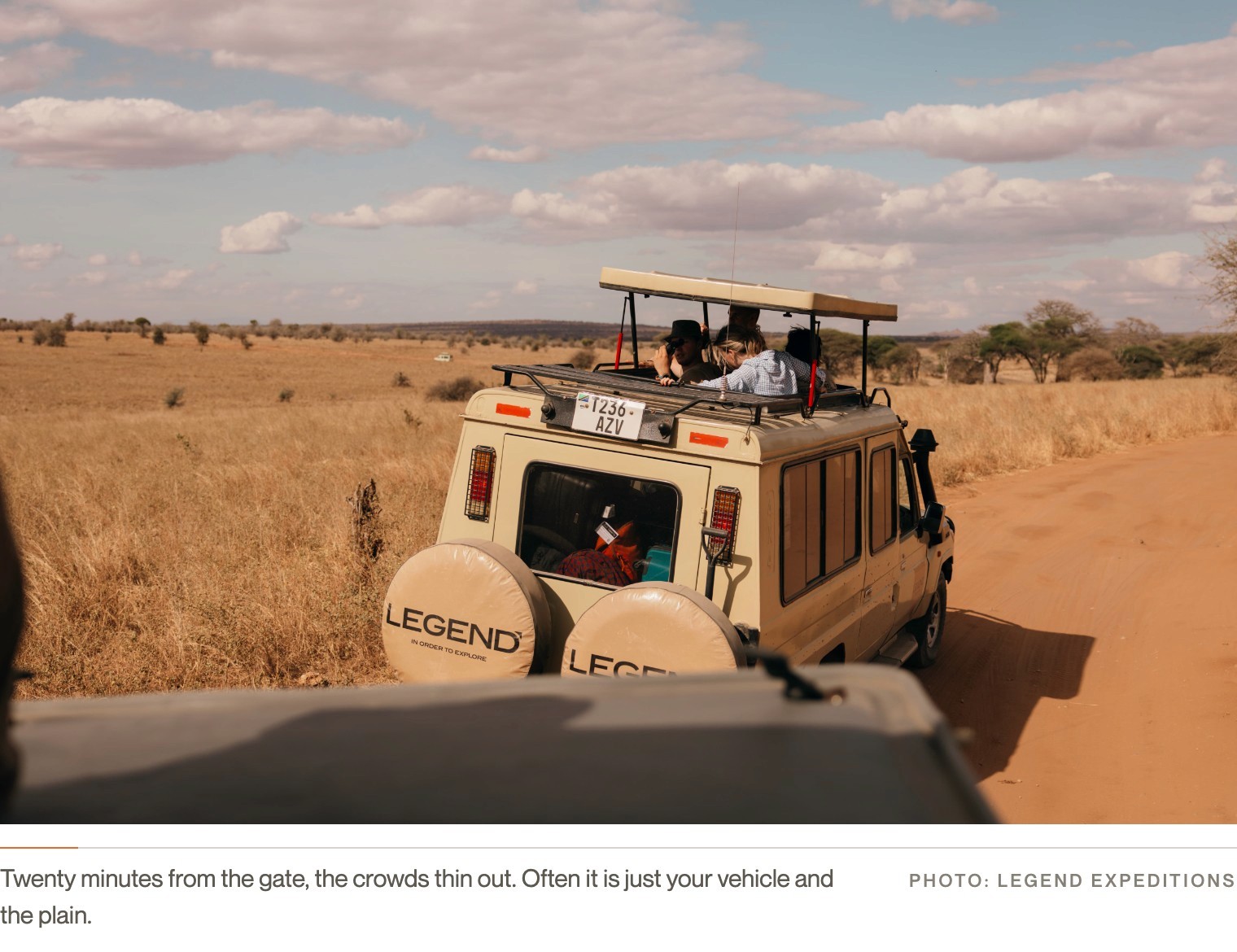 A Legend Expeditions safari vehicle alone on a quiet game-viewing loop in Tarangire