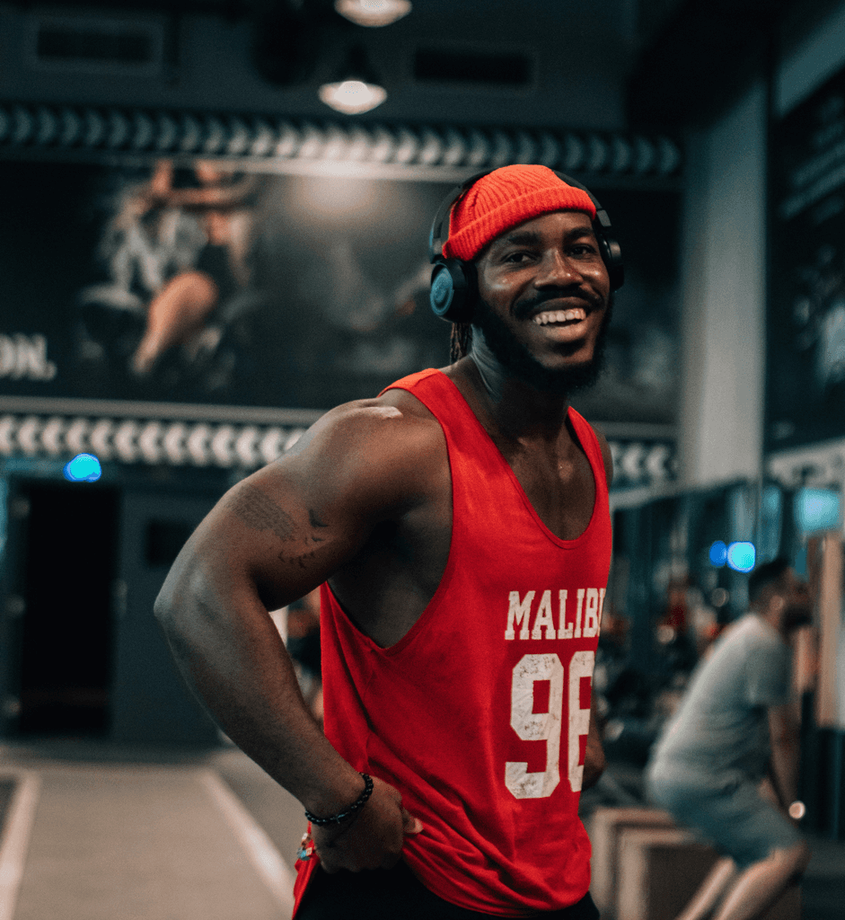 a man wearing a red shirt and headphones