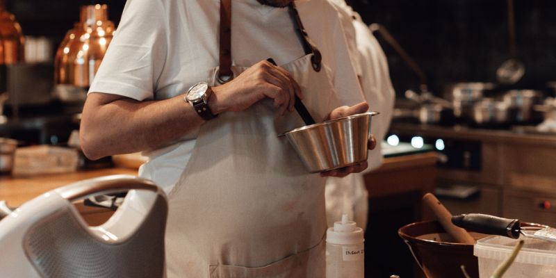 A Malaysian business owner cooking