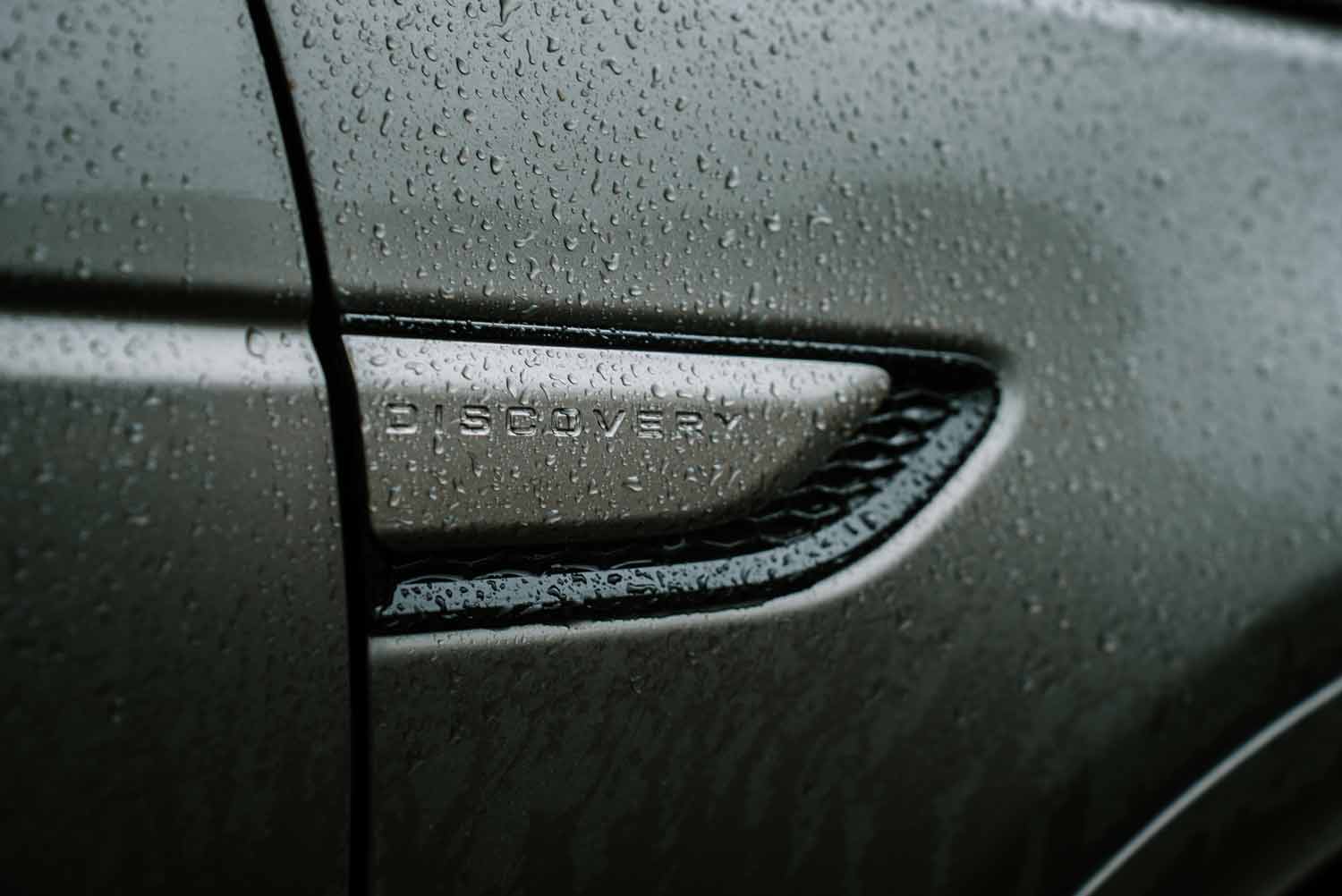 Rain-drenched car detail, ideal for filmproduction and ad campaigns.