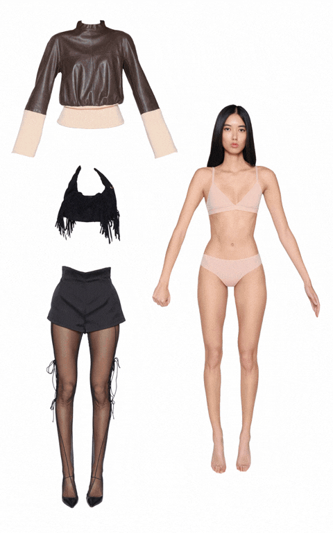 A person walks past buildings on a city street.