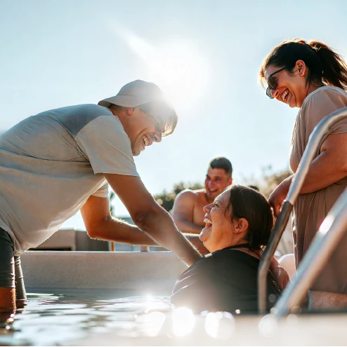 Group of people hangin in the pool having fun