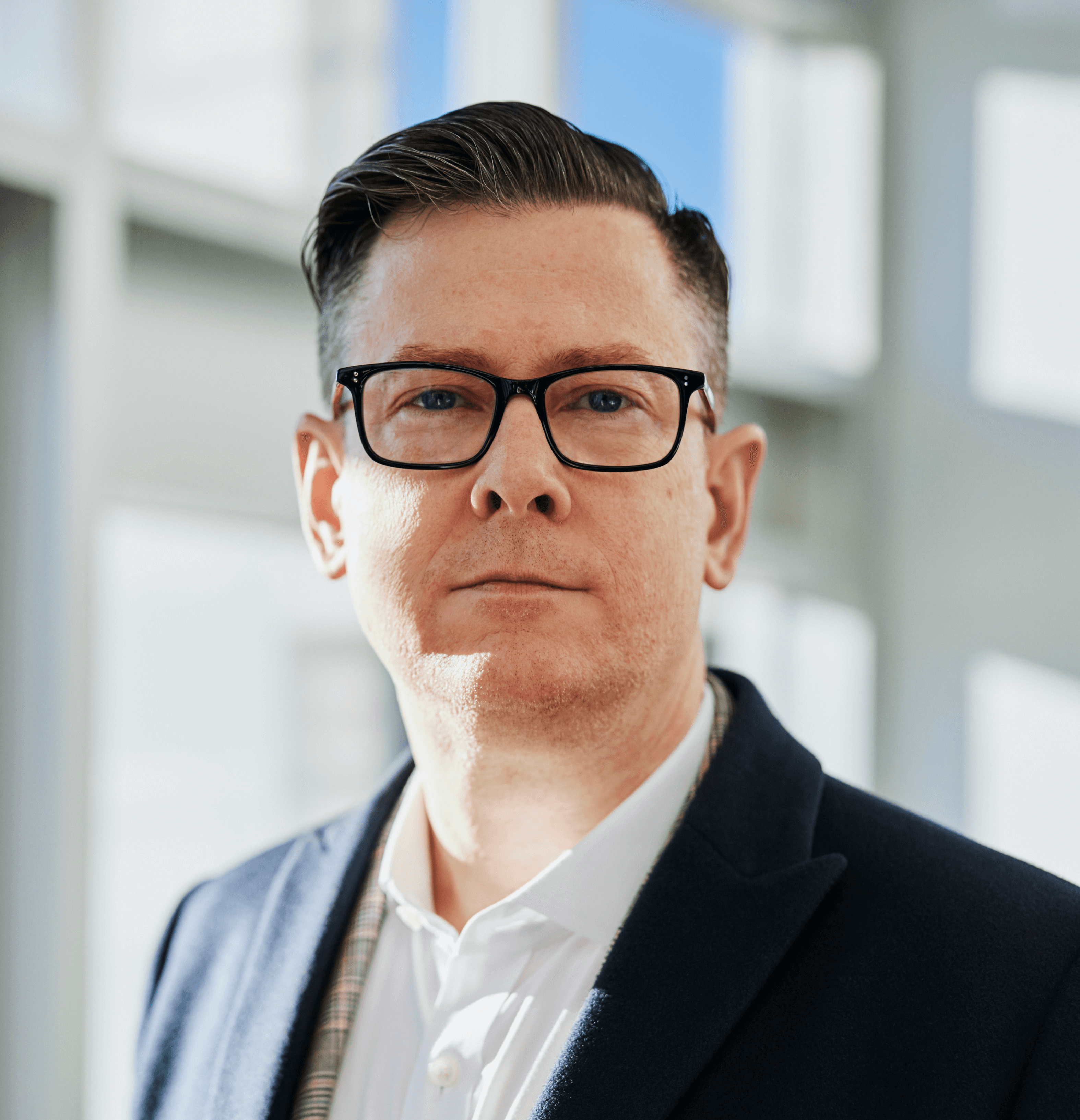 man standing beside wall