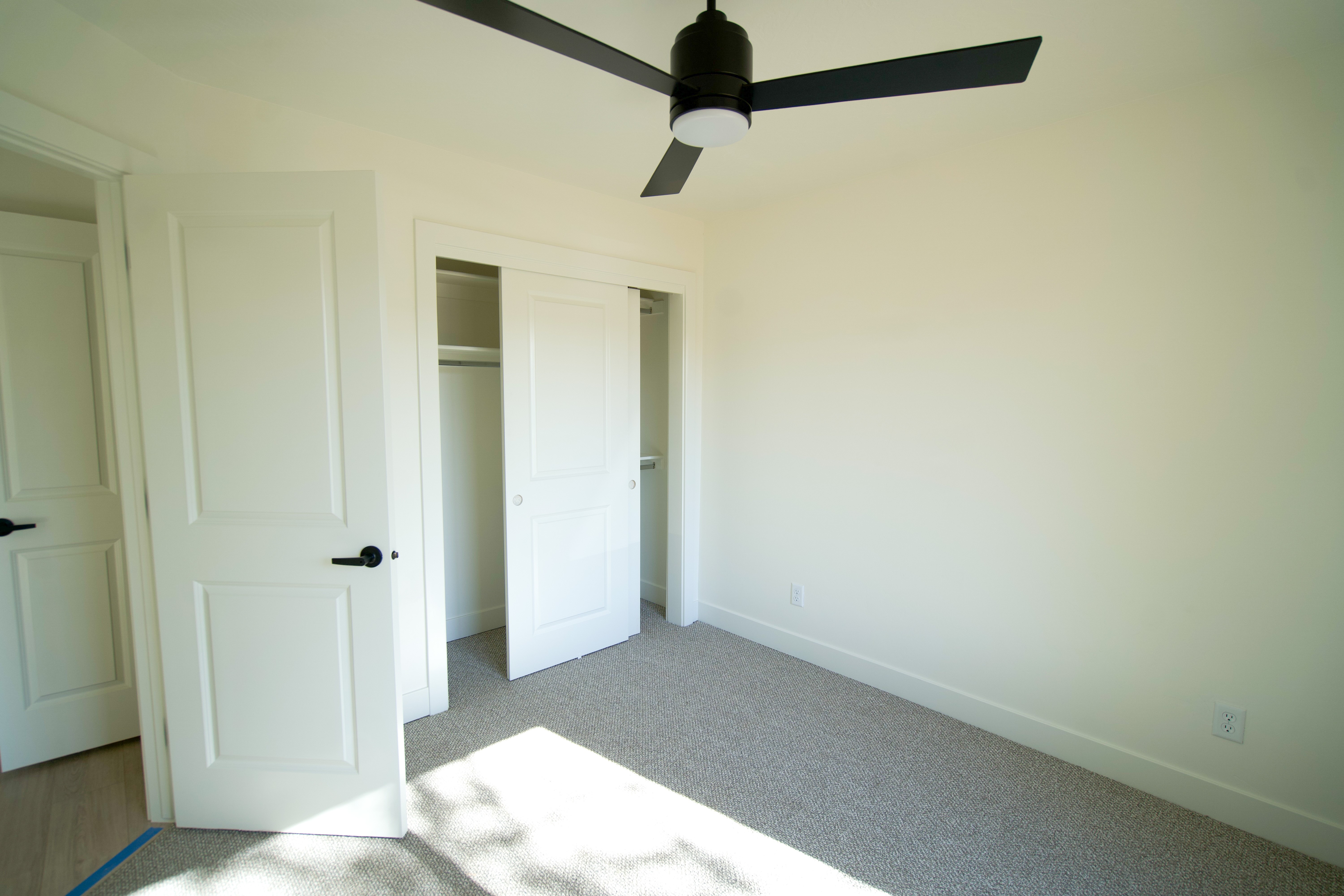 Secondary bedroom in Southern Utah remodel with clean design and modern aesthetic.