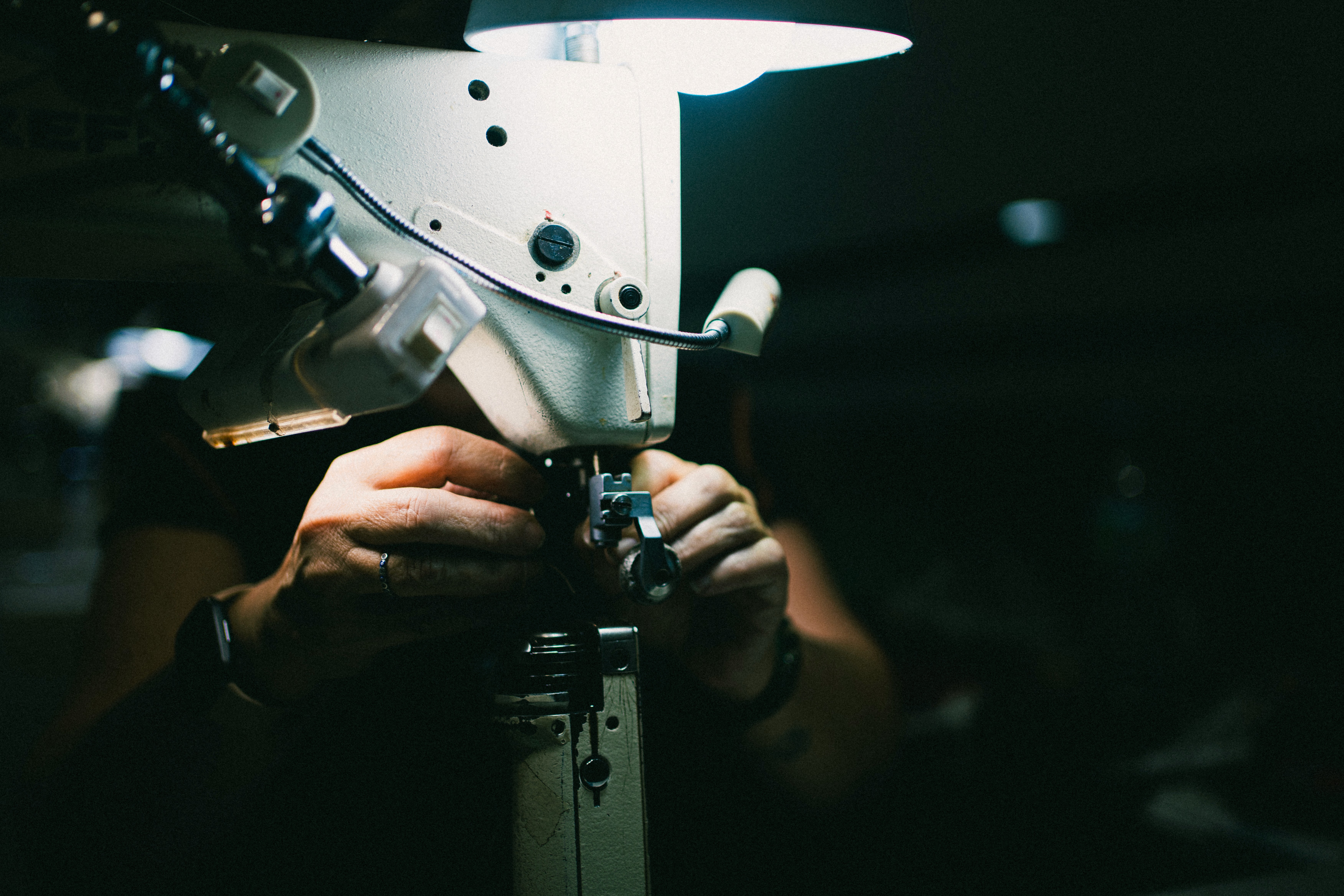 Two men wearing yellow and black face masks, standing side by side, with neutral expressions on their faces.