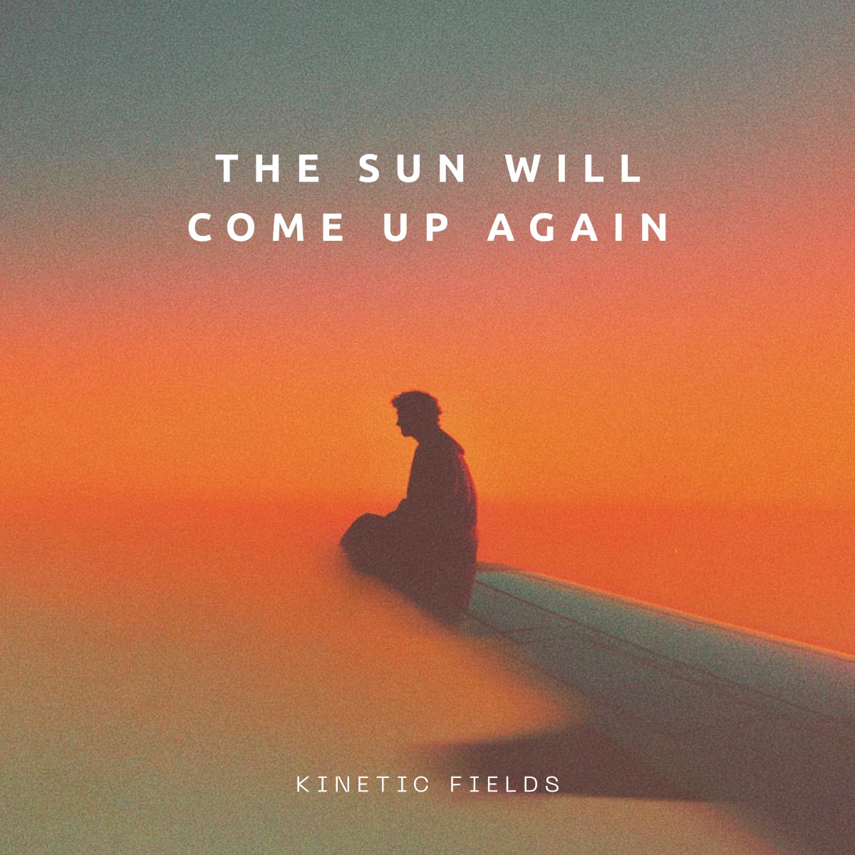 Close-up of a yellow tennis ball sitting on a green court, positioned near the white center line.