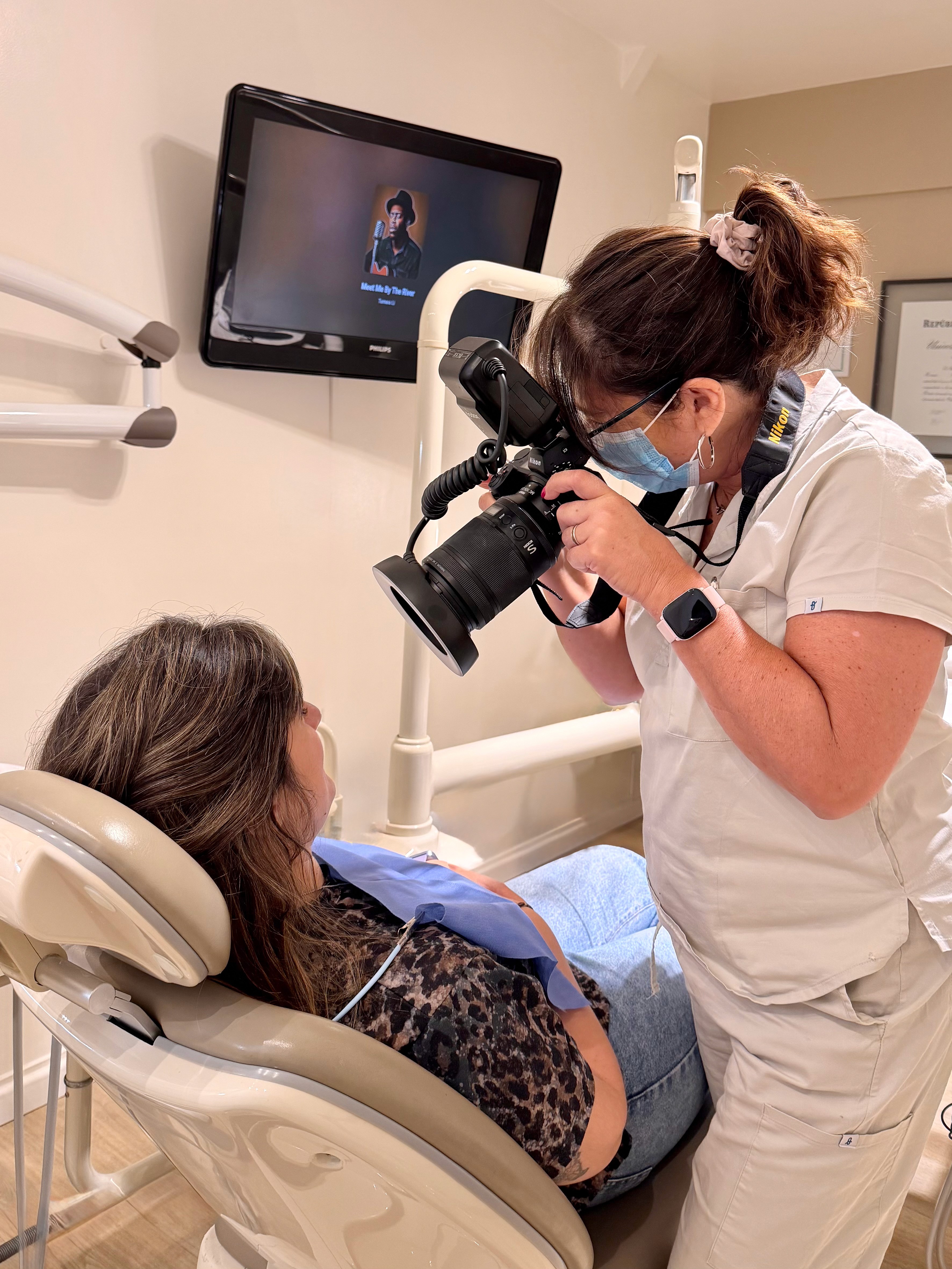 Modern dental clinic chair with equipment in a clean treatment room