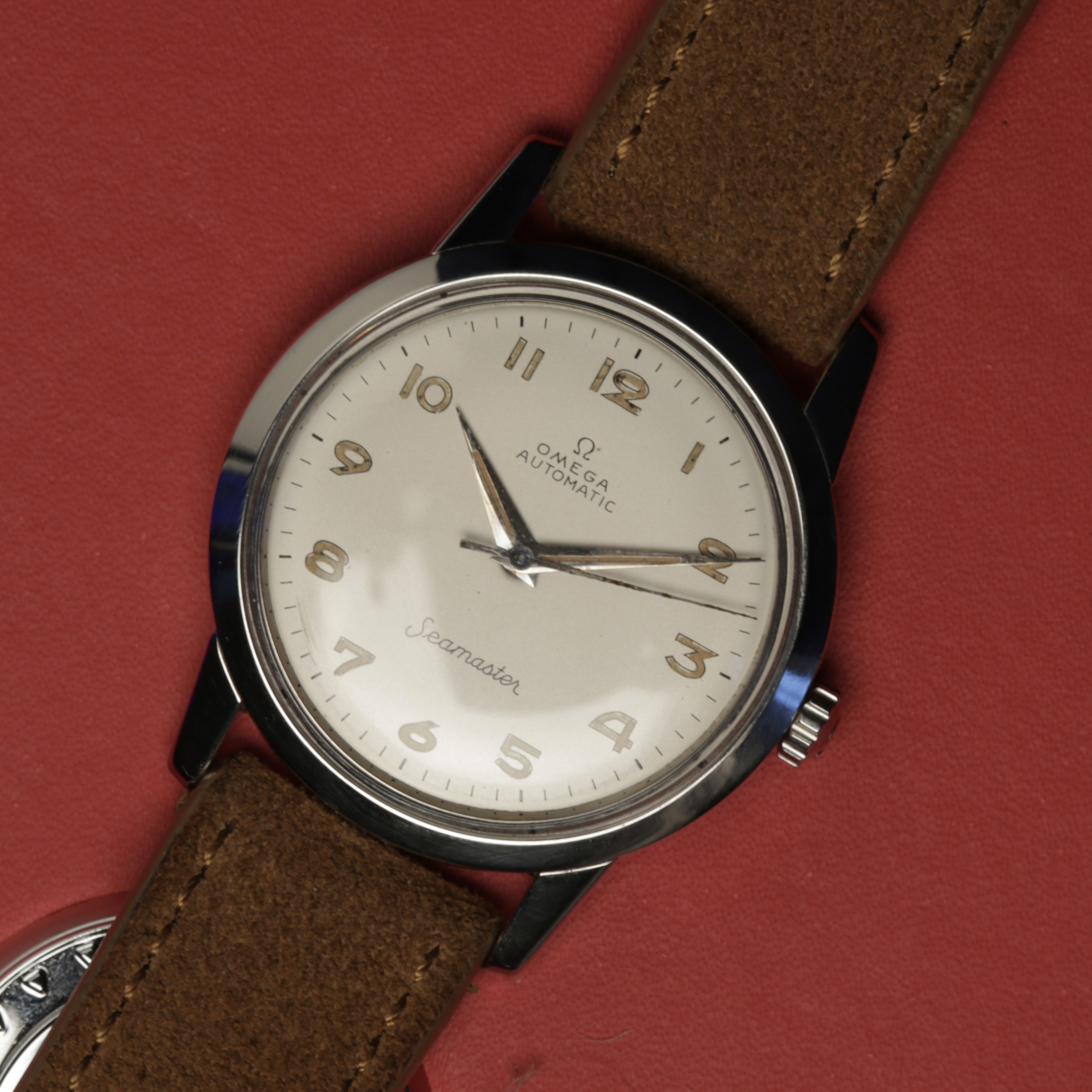 Gold luxury watch on dark fabric
