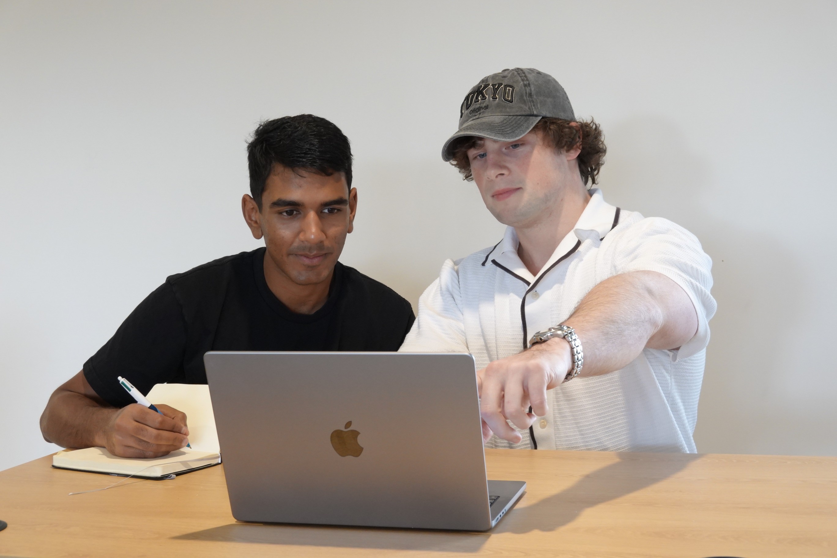 a couple of men standing next to each other
