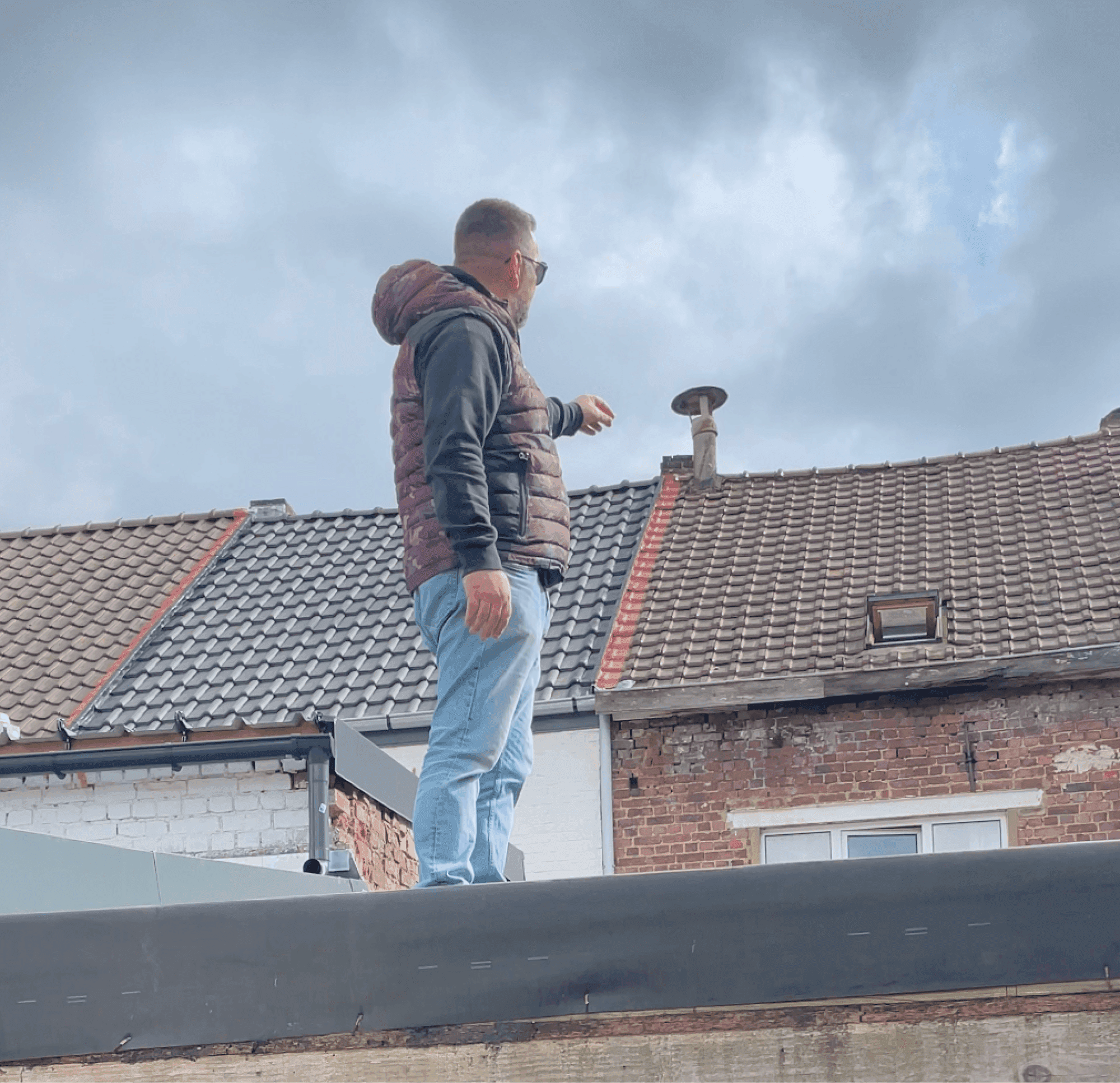 man in orange and black vest wearing white helmet holding yellow and black power tool