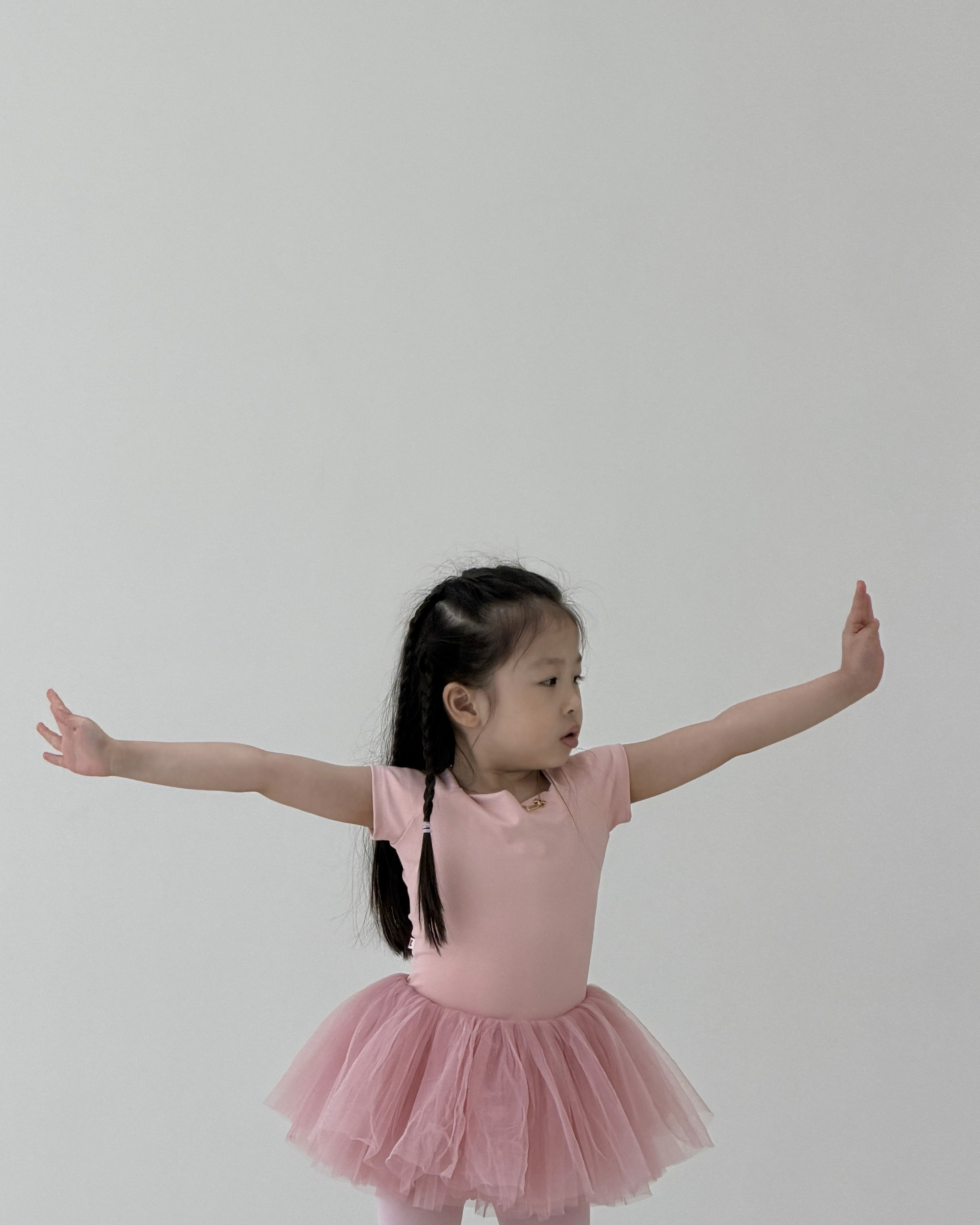 child ballerina wearing a pink dancing ballet tutu Rookids BGC