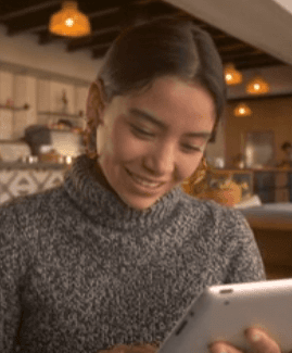 A Woman Working On An Electronic Tablet