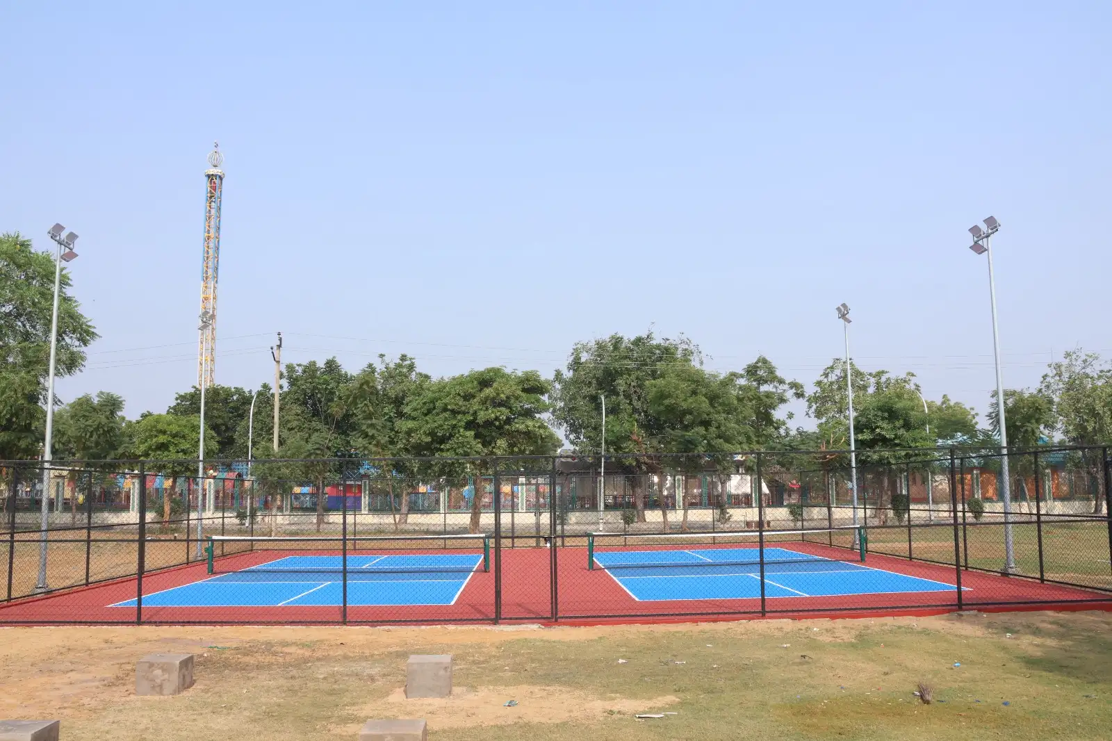 Sunlit minimalist hallway with staircase, wooden bench, plants.