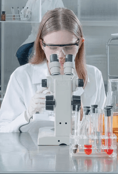 white microscope on top of black table