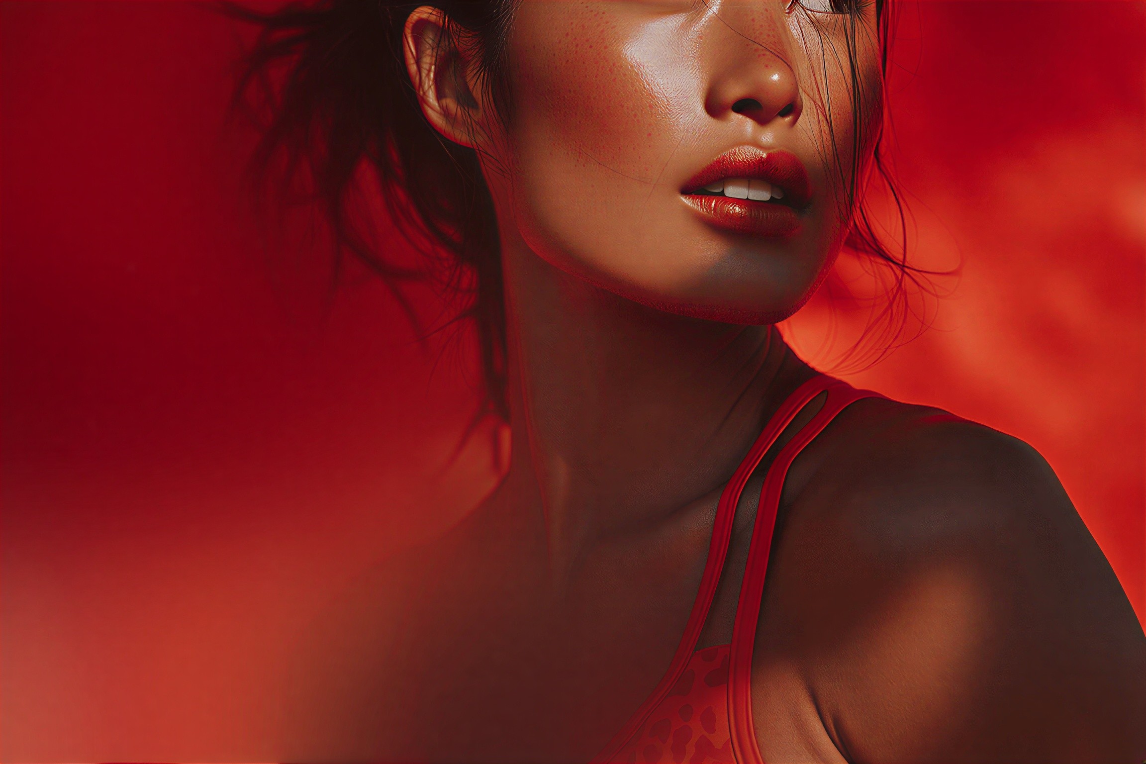 Sweaty athletic woman in red leopard sports bra looks sideways