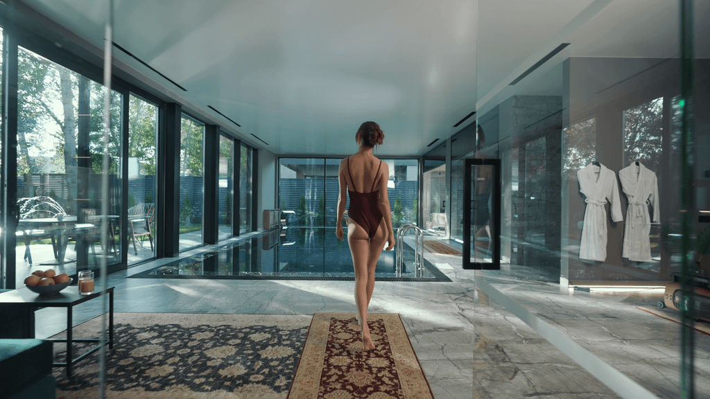 A beautiful girl is walking to the pool