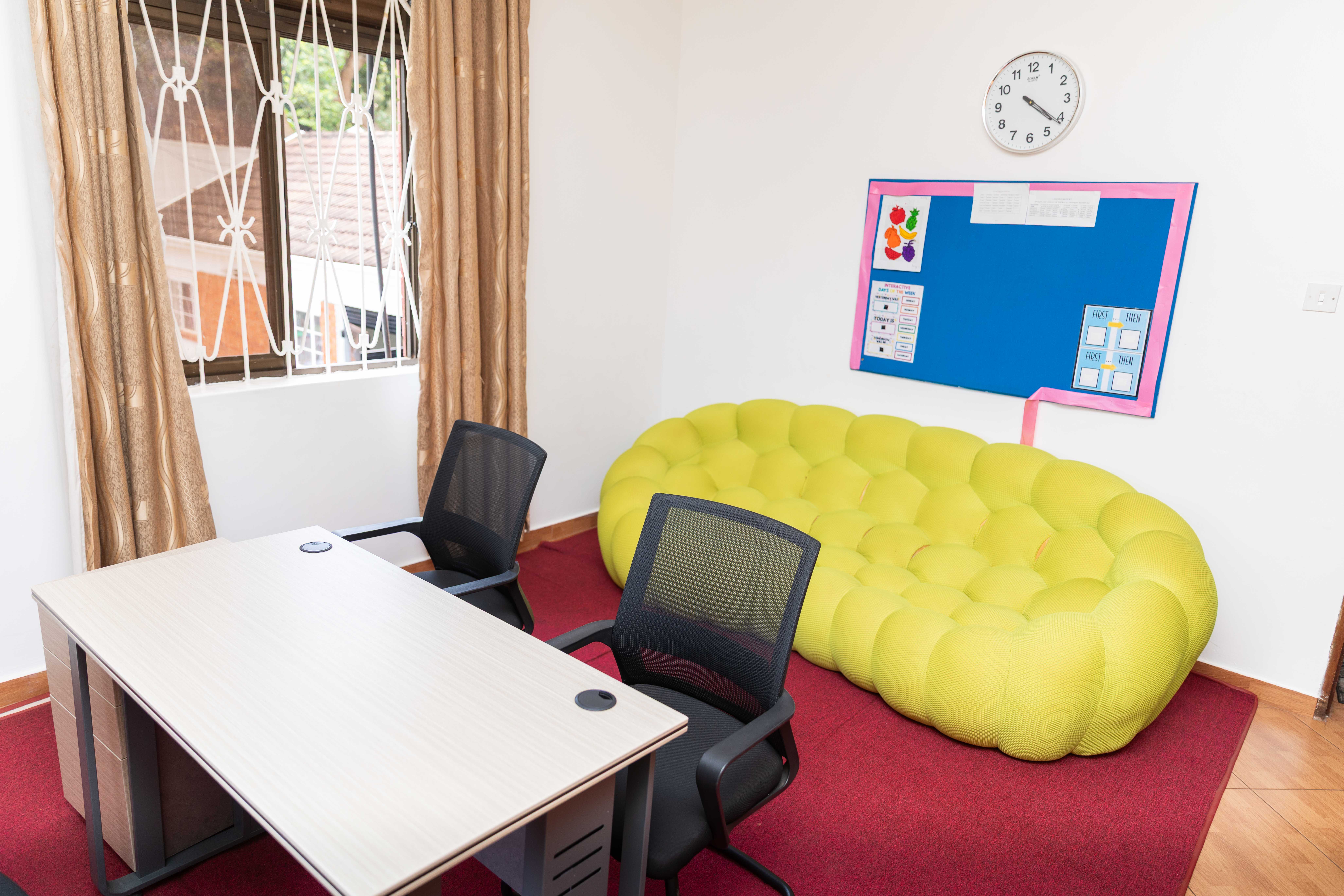 A school building stands against the backdrop of a clear sky