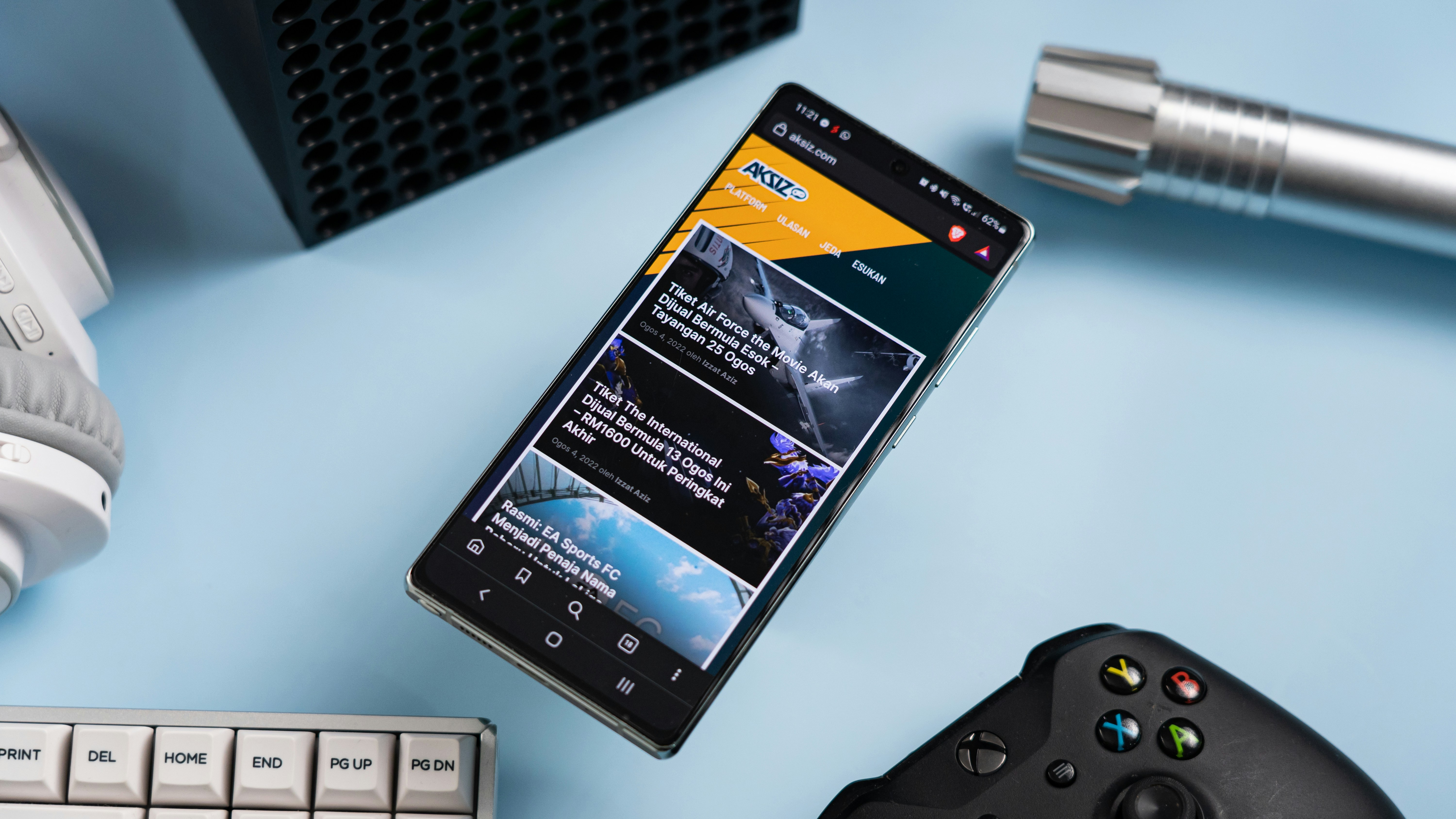 a cell phone with a pen and a calculator