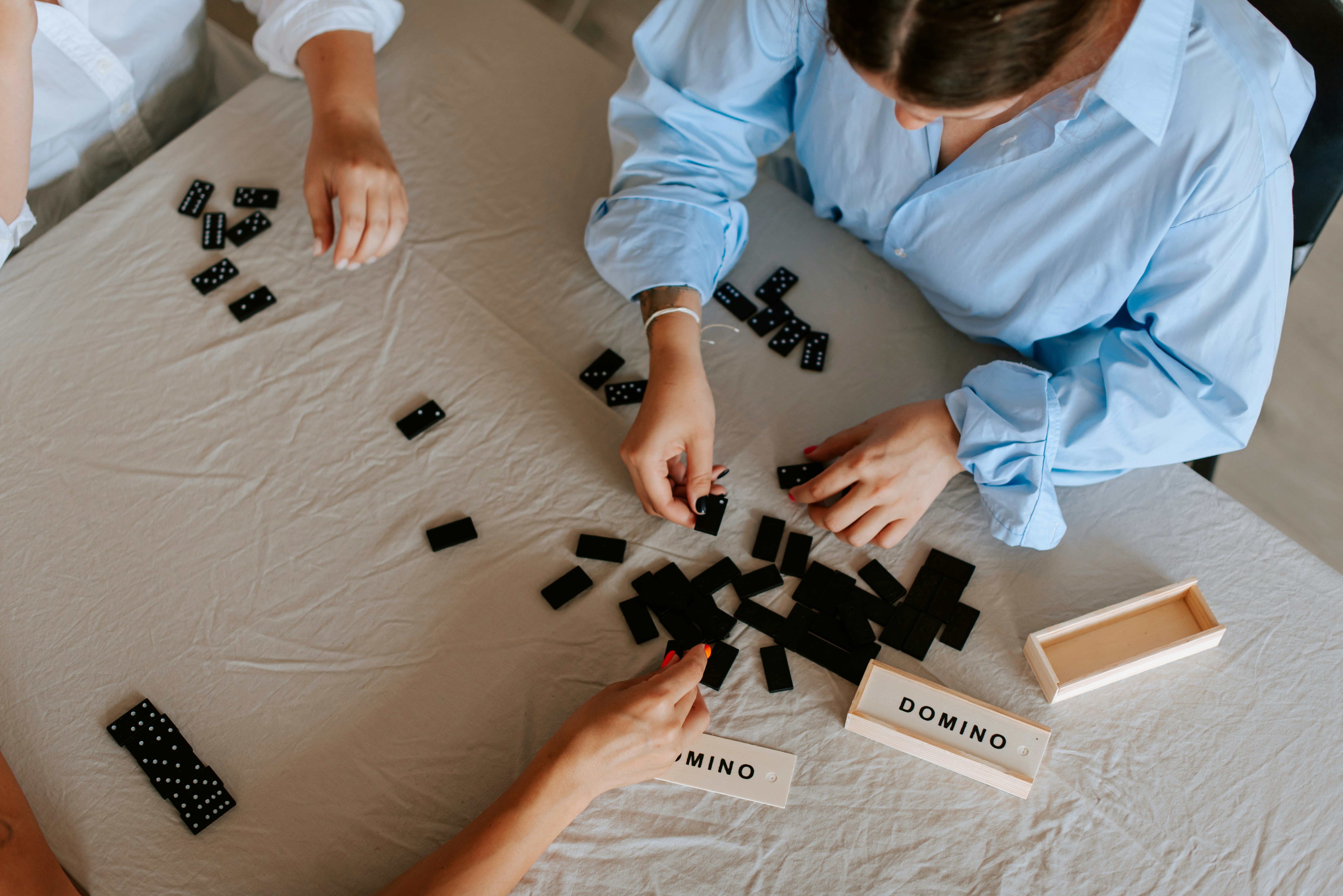 man in grey t-shirt holding white ceramic plate