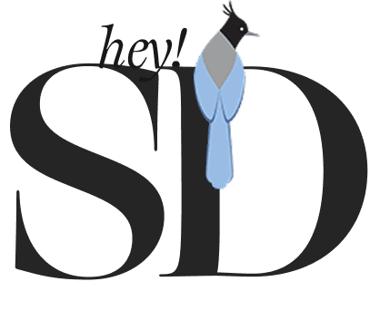 Neiman Marcus editorial featuring woman in elegant dark textured jacket showcasing classic beauty and sculptural fashion