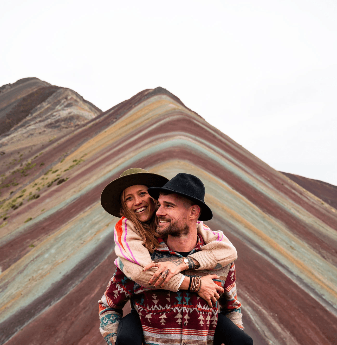 Bre and Flo smiling at Rainbow Mountain, Peru.