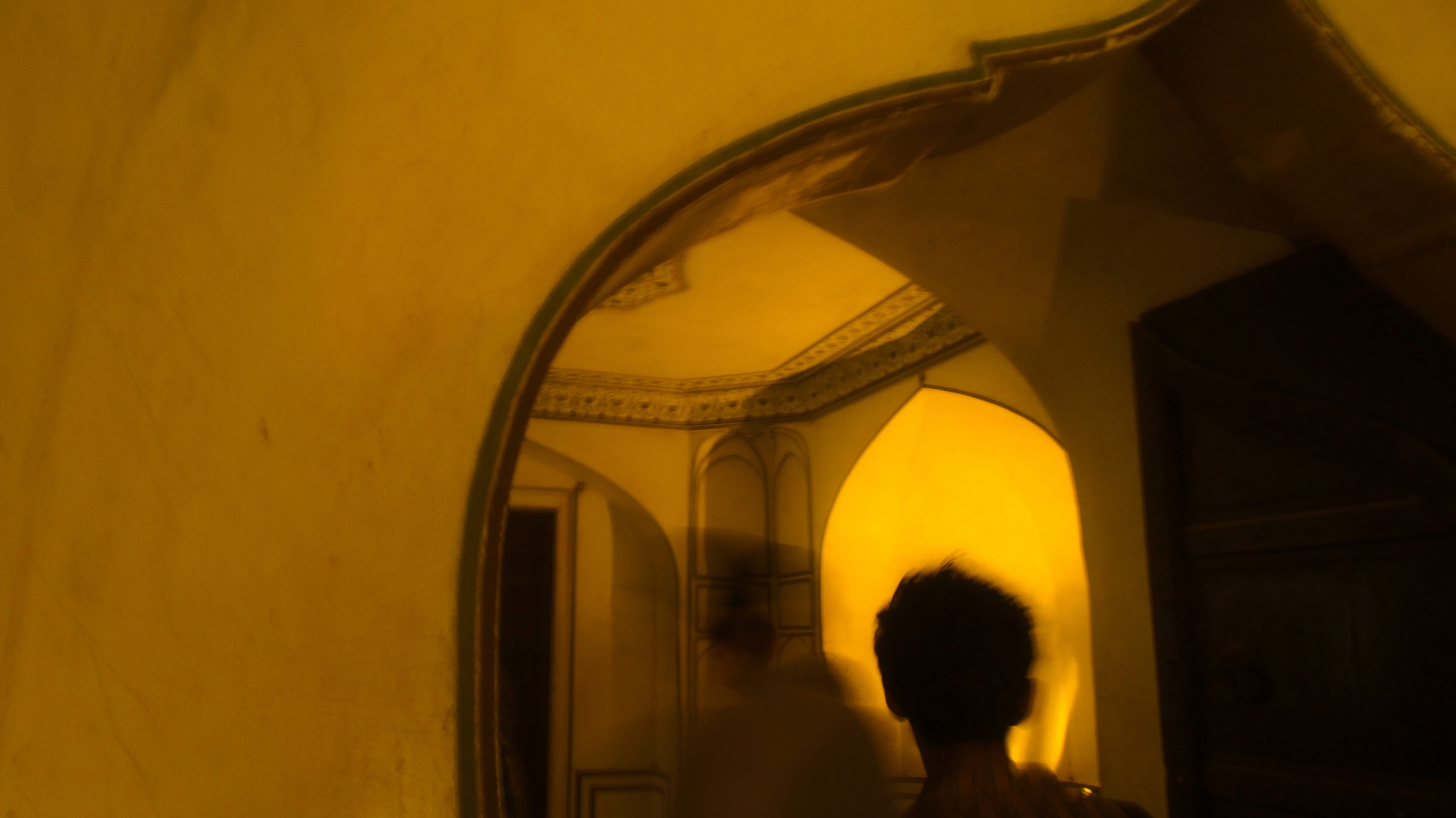 a person holding a small bowl of food