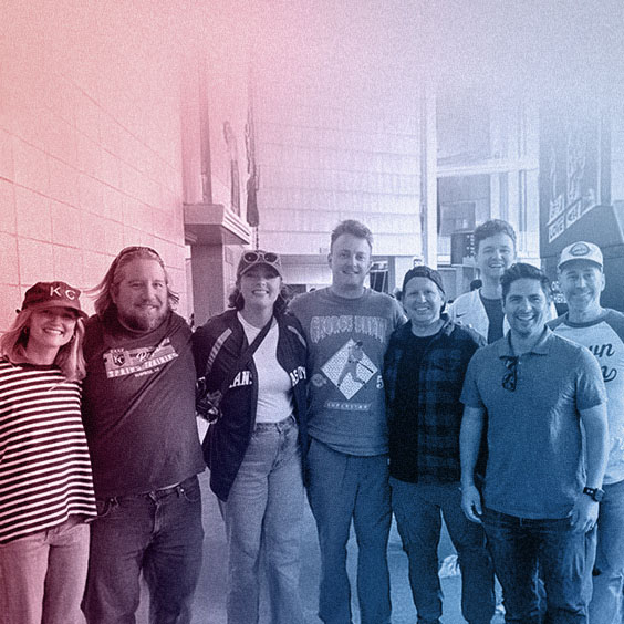 WTADS crew at royals game with red blue gradient overlay.