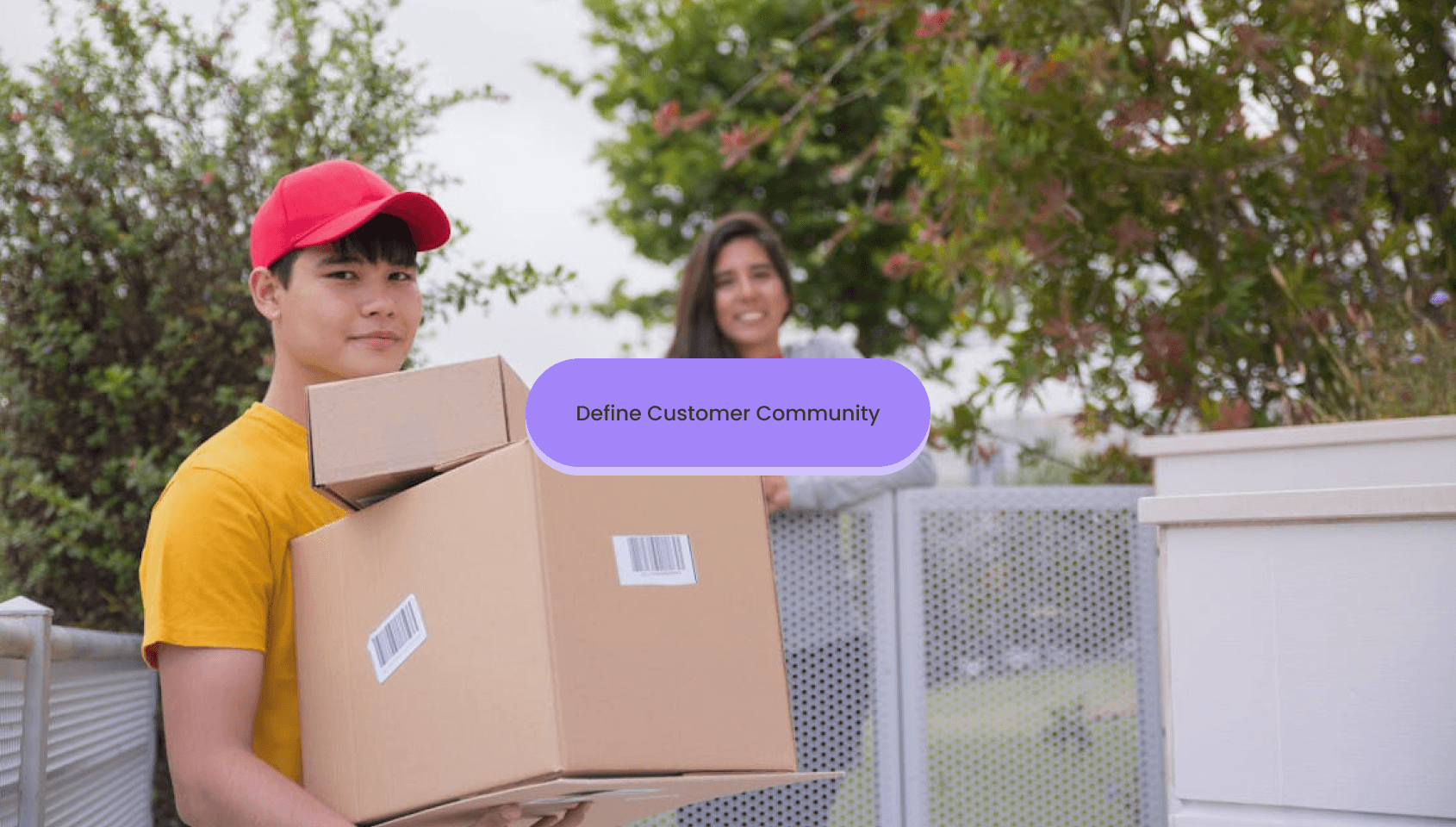 A courier person gives the parcel to a happy customer.