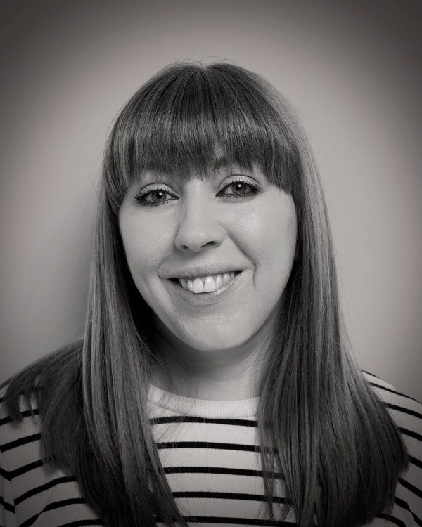 headshot of female in bright background