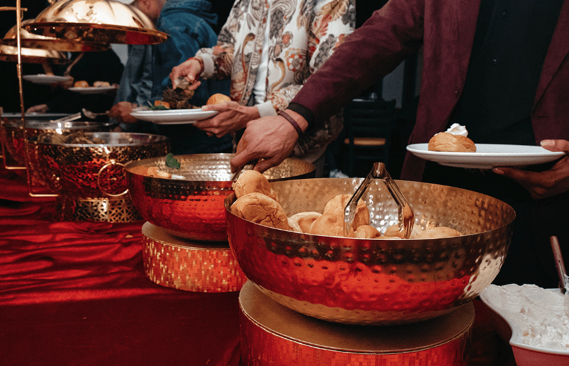 Guests serving food at event