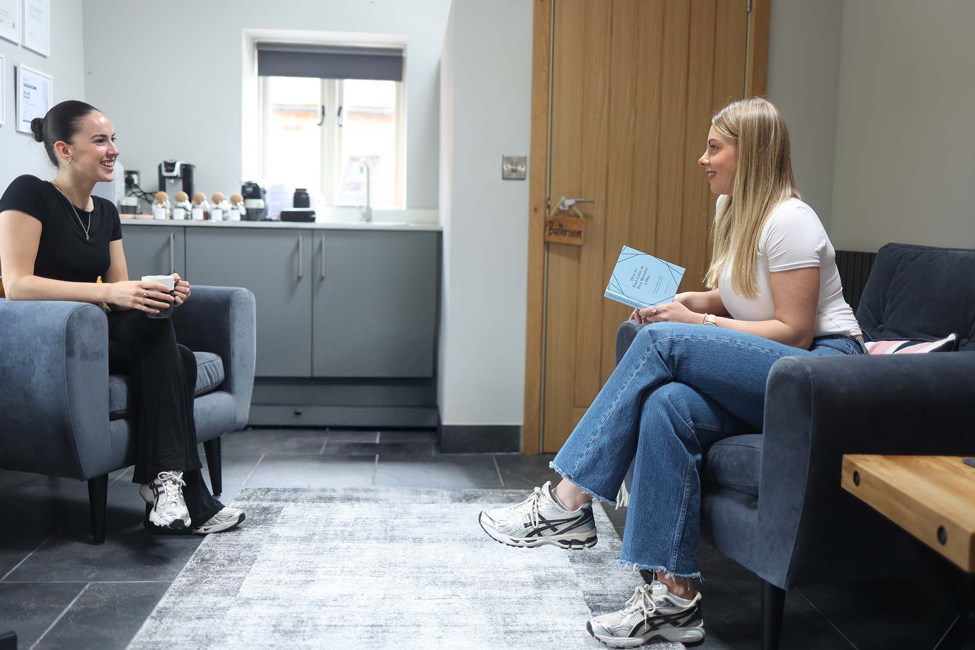 melanie brown talking with a client over a skin consultation