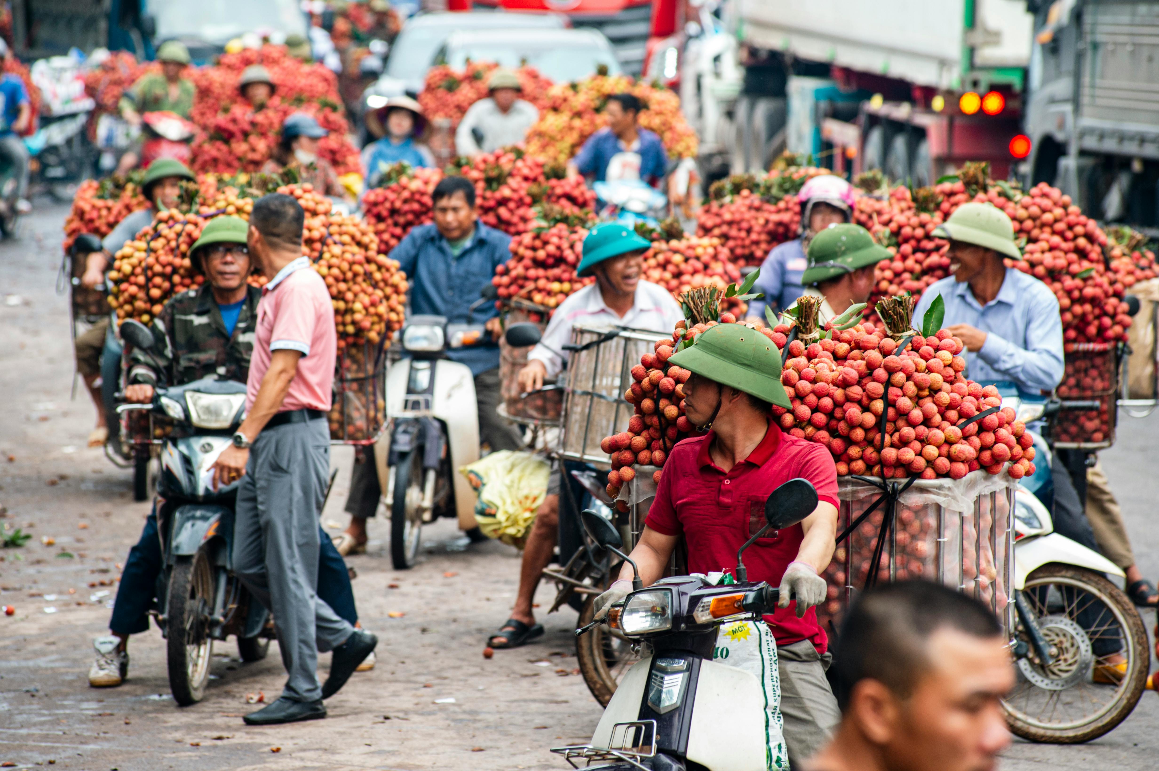 a hand holding a coin in front of a machine