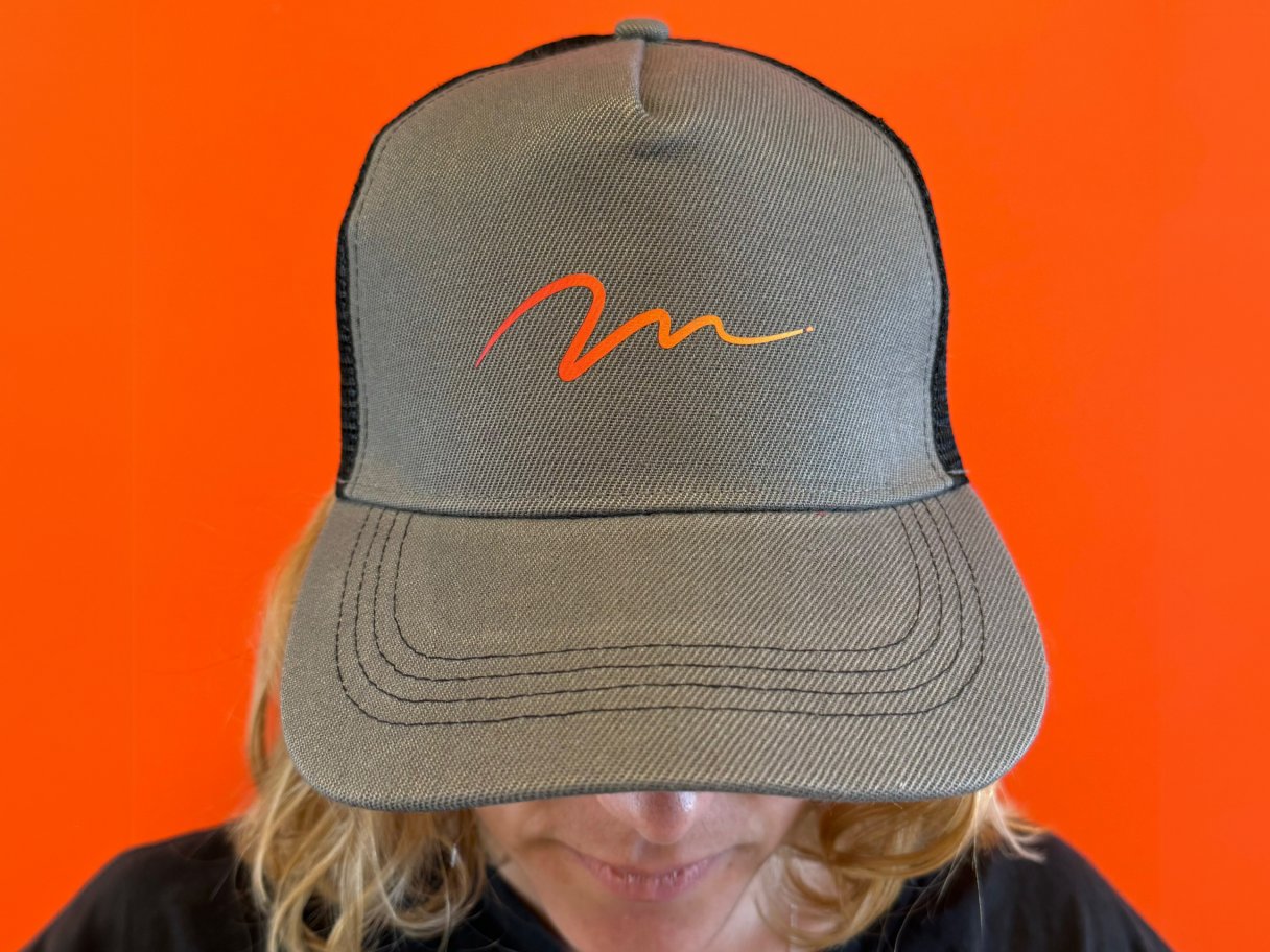 Rustic cabin in a golden field at sunset