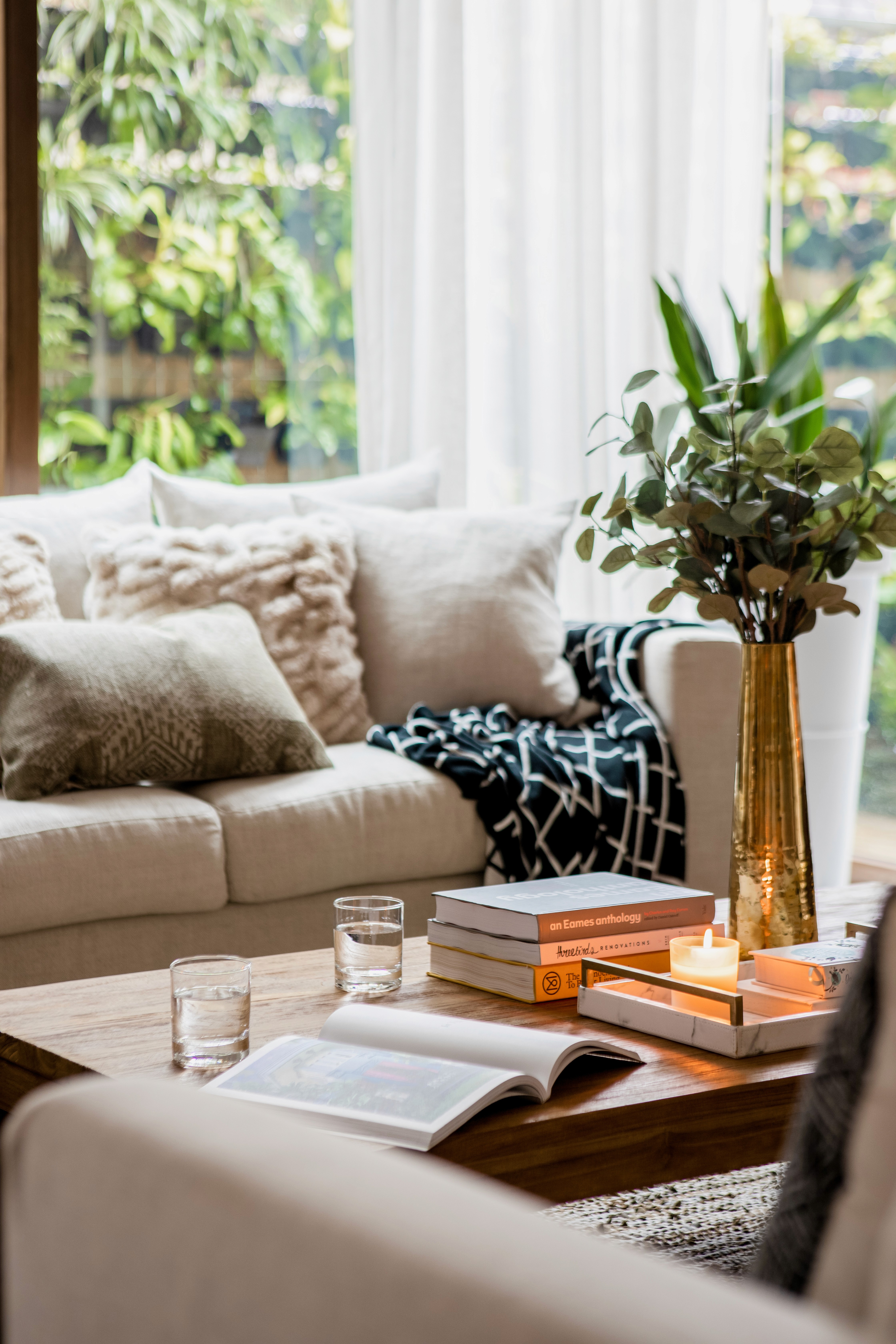 Boho chic living room sofa with a mix of patterns, textures, and colors by Ventura & Los Angeles interior designer Jubilee Interiors