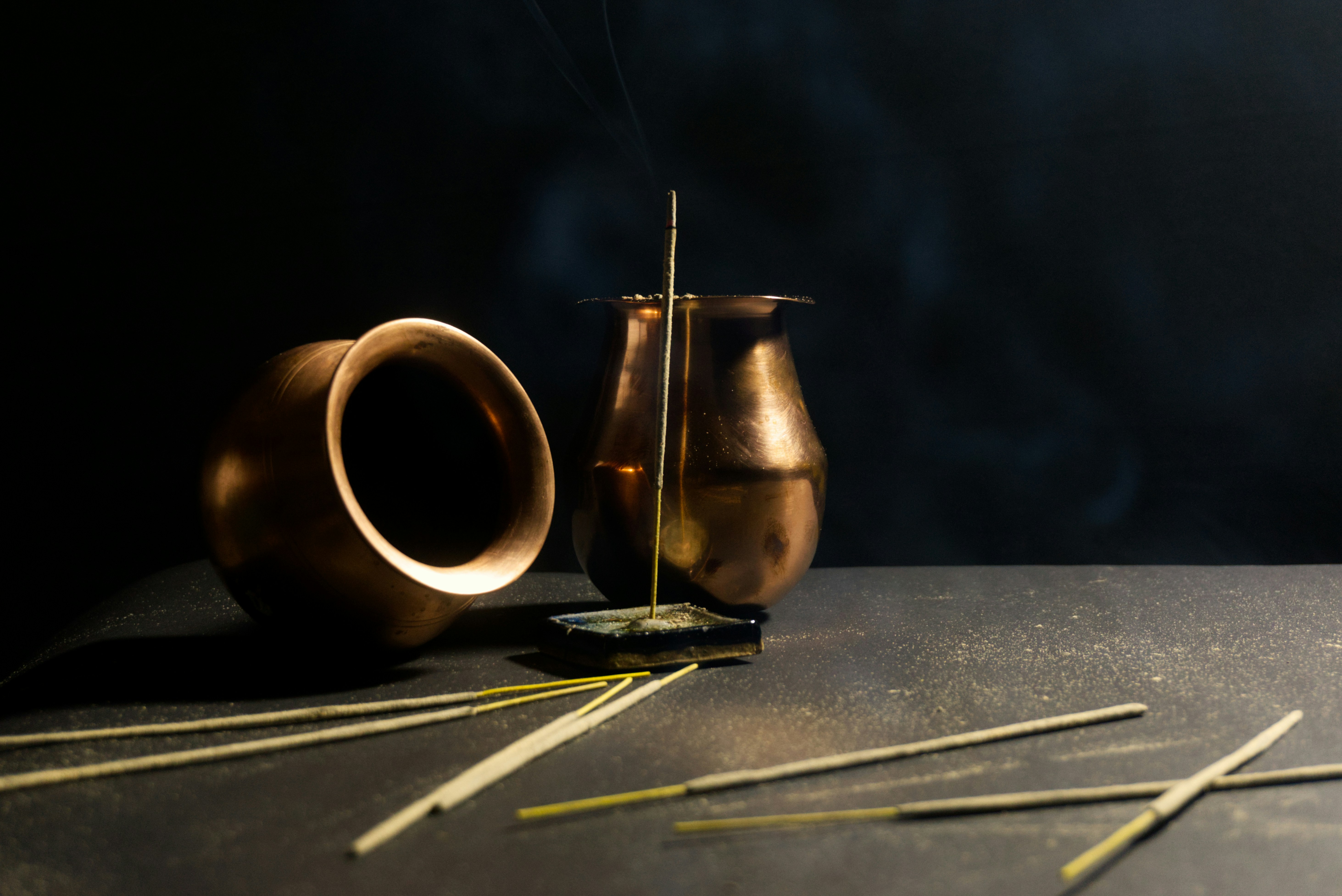 a couple of vases sitting on top of a table