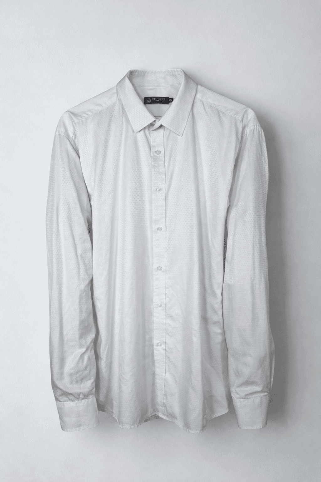 Light gray long sleeve shirt on a plain background