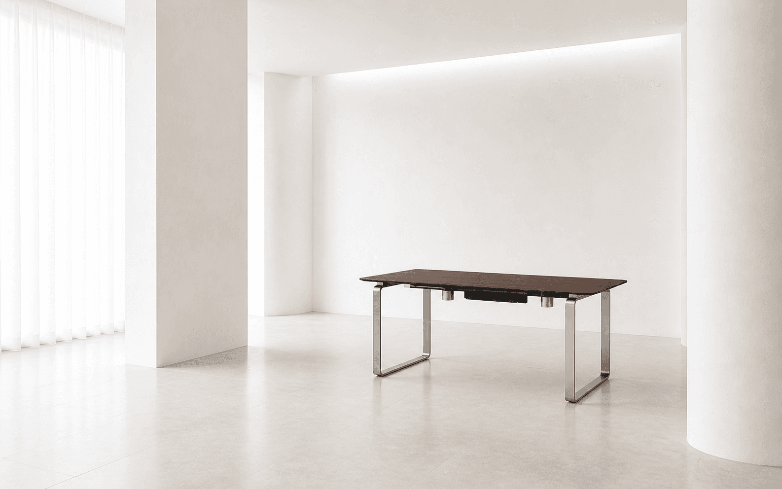 Relay walnut desk standing alone in a serene white consultation room